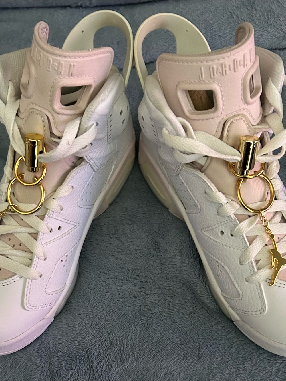 Jordan Women’s Pink and White High-Top Sneakers with Gold Hardware